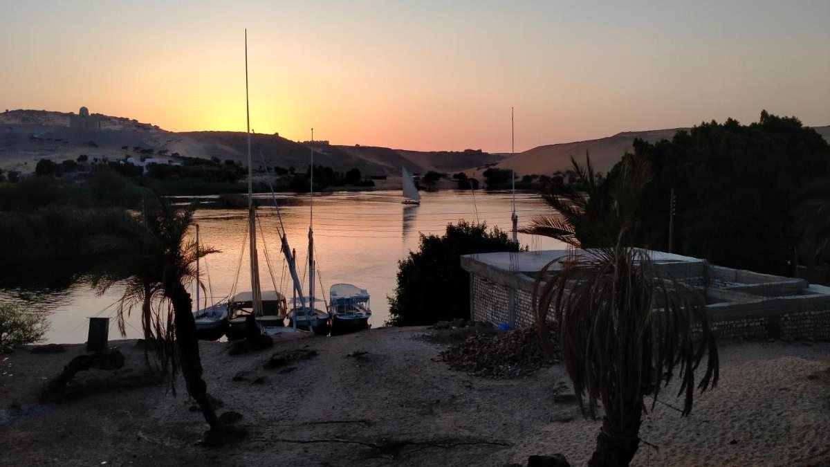 Feluccas moored by the island at sunset